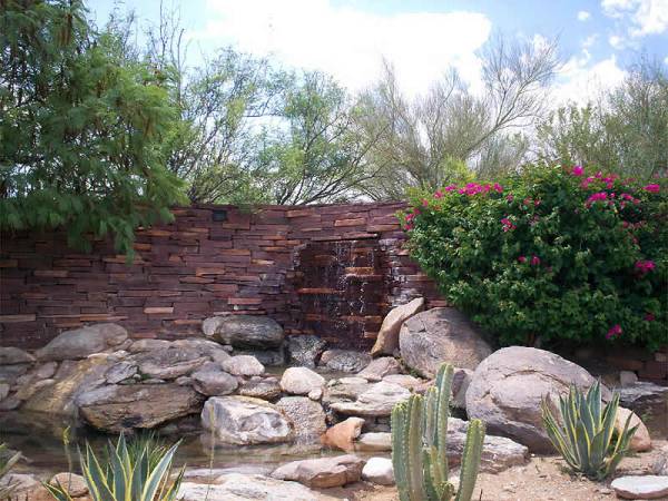Water feature ideas for the creative minded. The water source comes from the flagstone wall instead of a built up feature in the corner.