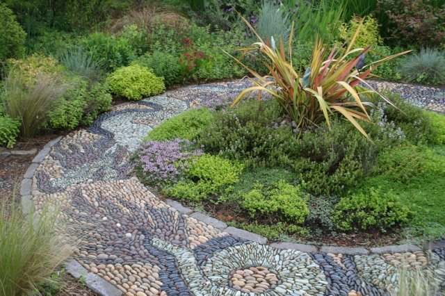 This very creative and beautiful walkway of different coloured stones is considered a mosaic.