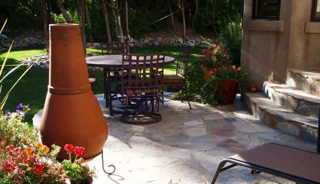Natural flagstone patio makes a nice quaint place for an outdoor meal.