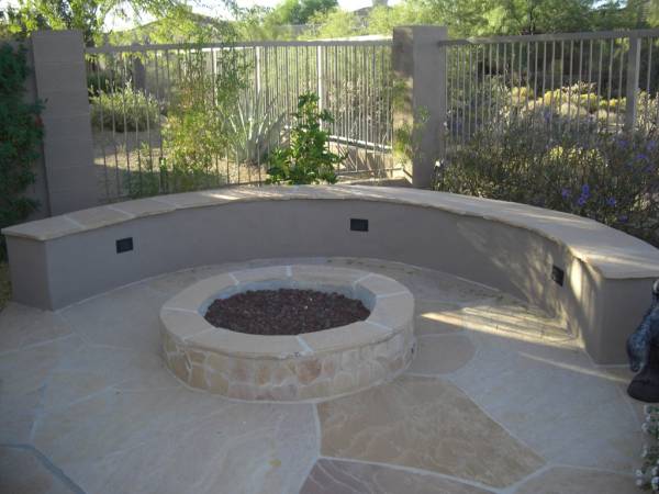 A formal mortared flagstone firepit area. 