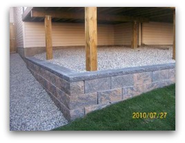 Manufactured block retaining wall.