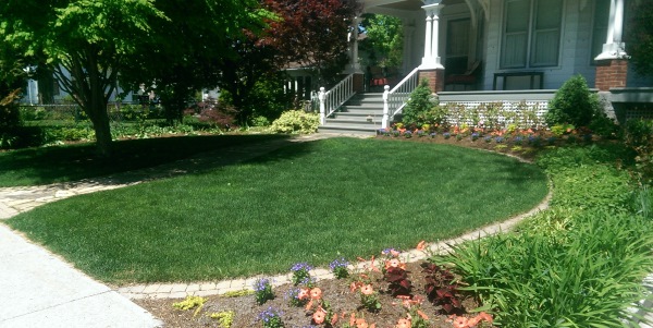 Brick edging was used as a way to provide easy mowing and a clean defined border for this front yard.