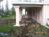 After ripping out a concrete patio, we replaced it with stone, raised the height and resodded while blending to the existing lawn.