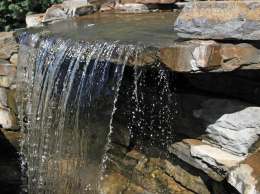 Waterfall running over stones.