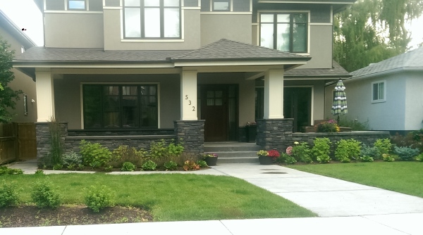 A front yard shown here using plants of similar shapes and sizes is called asymmetrical balance.