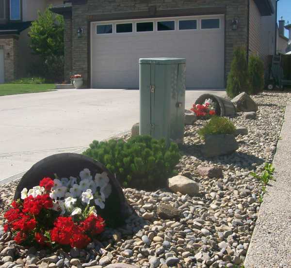 Drawing the eye away from a utility box can be more effective than trying to hide it.