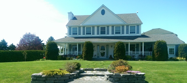 A nice flagstone front entry was added to this property to break up the large front lawn and add some curb appeal.