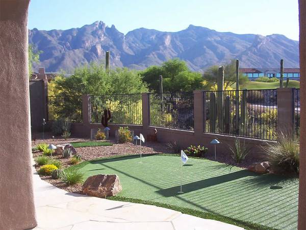 Backyard putting greens have become a great low maintenance way of adding another feature to your yard.