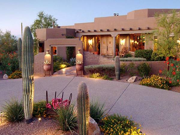 This front yard is just starting to take on the elegance of the evening as the lights take over from the sun.