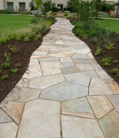 Cut flagstone walkway with small gaps (about 1 inch).