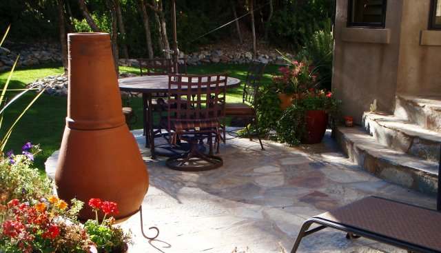 Natural flagstone patio makes a nice quaint place for an outdoor meal.