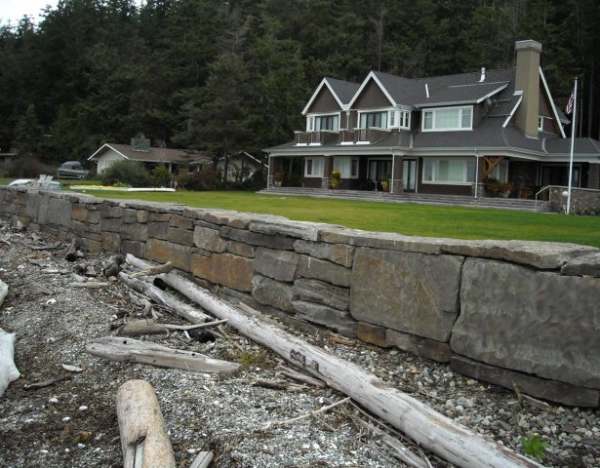 "Placement walls", are large rock walls where specialty equipment places each stone.