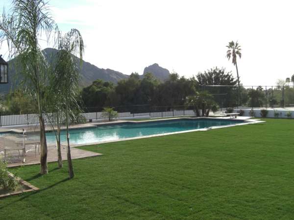 A very simple and clean design for a desert region backyard with a pool.