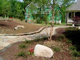 This flagstone walkways looks right at home in this country landscape.