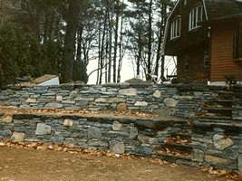 This multi level flagstone wall with fieldstone mixed in at various spots, has tons of character.