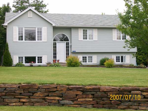 This 160 ft. ironstone wall, snakes through the whole front yard of this large property.