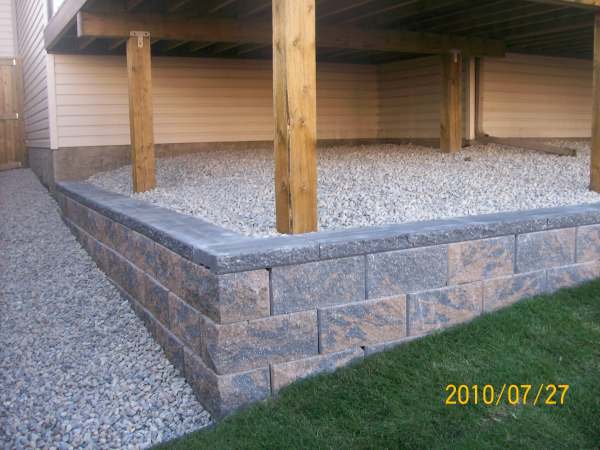 This small wall was added to eliminate having a slope that would be difficult to mow.