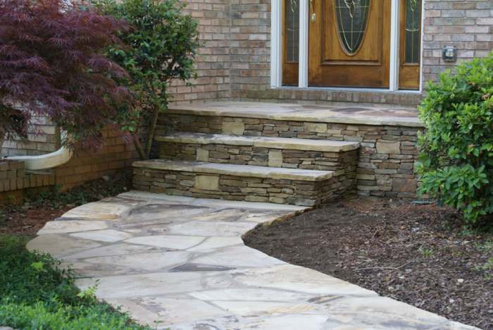 Flagstone walkway leading up to front door steps. 