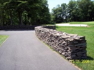 Dry stacked stone walls finish off just about any landscape.