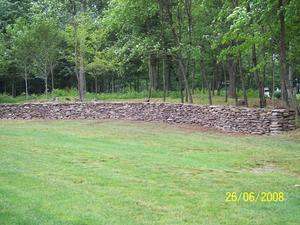 Man has used free standing stone walls for dividing property as fences for thousands of years.