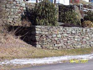 Selecting and placing just the right stones for building corners can be a very timely process.