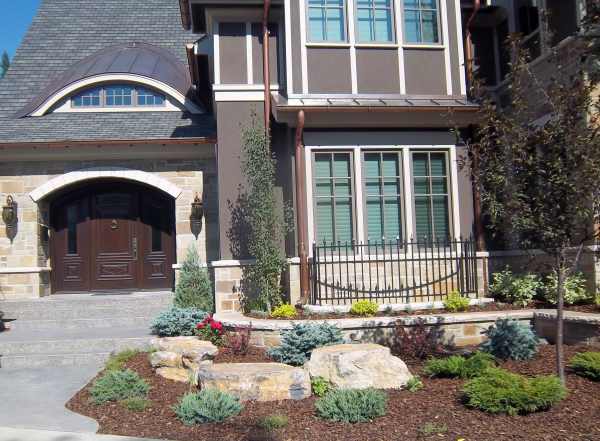 Small front yard design mixing formal and informal elements.