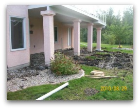 Before shot of a lawn that will need to be blended with new sod, soil, and the old lawn.