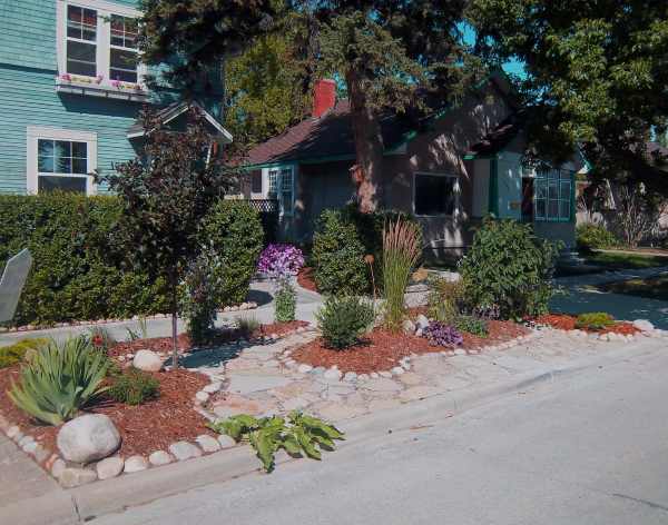 This designated heritage property in the middle of a city has a front yard full of character.